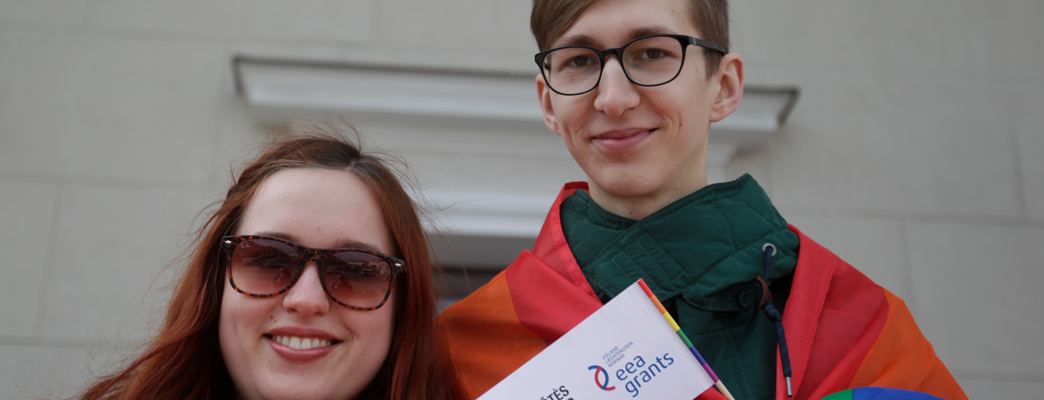 Two young people with EEA Grants banner - Photo:LGL