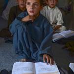 An Afghan child is seen while studying in a local school, September 2016, Qandahar, Afghanistan