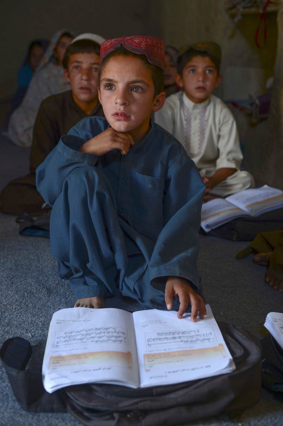 An Afghan child is seen while studying in a local school, September 2016, Qandahar, Afghanistan