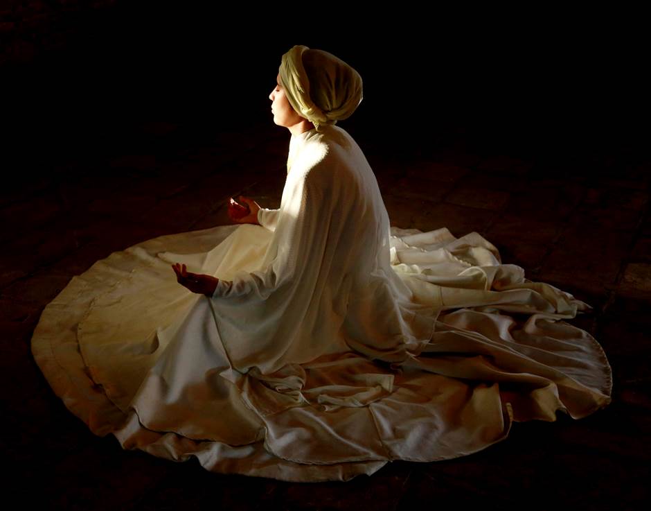 An Afghan girl sits during Sama dance (a Sufi performance), 2020, Kabul, Afghanistan.