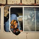 An Afghan girl with her mother while sitting on a mini-bus, June 2020, Karukh district of Herat prov