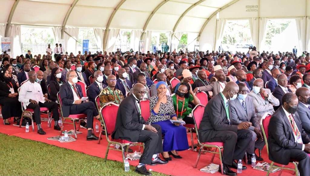 A large group of people in a tent attending the Makerere 100 year Anniversary
