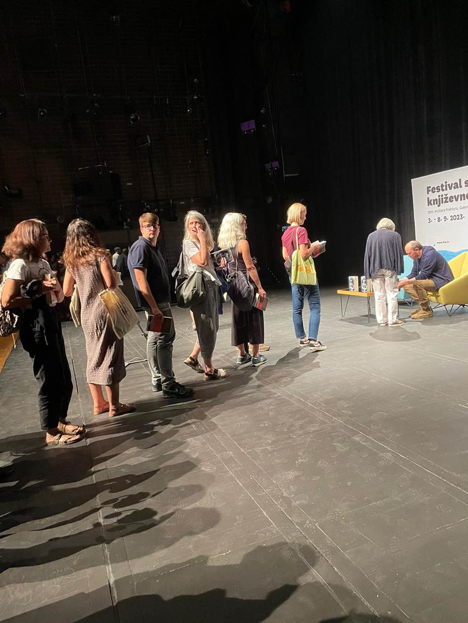 Harstad signing books